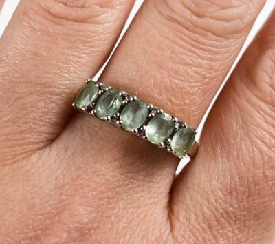 Lot 33 - A 9ct white gold and prasiolite five stone...