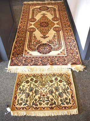 Lot 478a - A North Indian rug, cream ground with red...