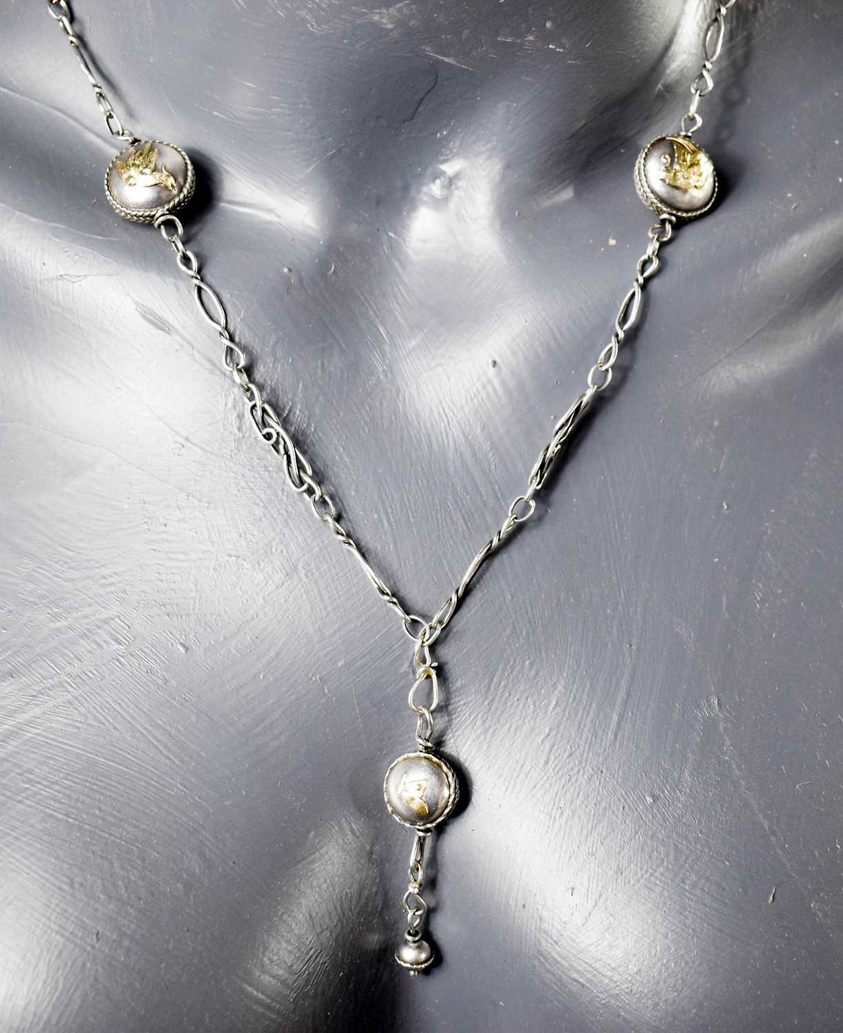 Lot 70 - A white metal necklace with decorative links,...