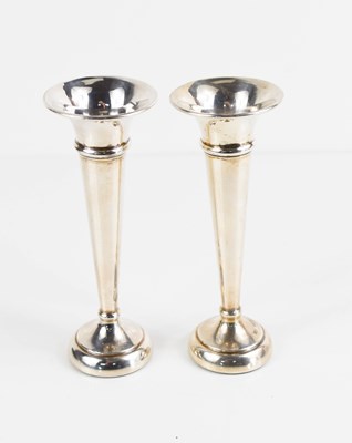 Lot 296 - A pair of sterling silver bud vases, weighted...