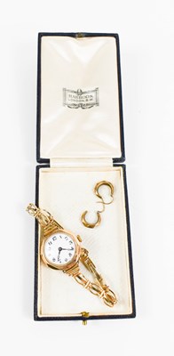 Lot 112 - A 9ct gold 1930s wristwatch with 12ct rolled...