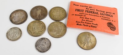 Lot 420 - A group of silver dollars and half dollars,...