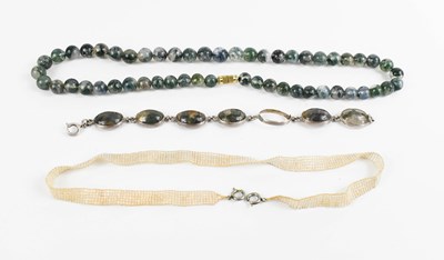 Lot 157 - A moss agate and silver bracelet (one cabochon...