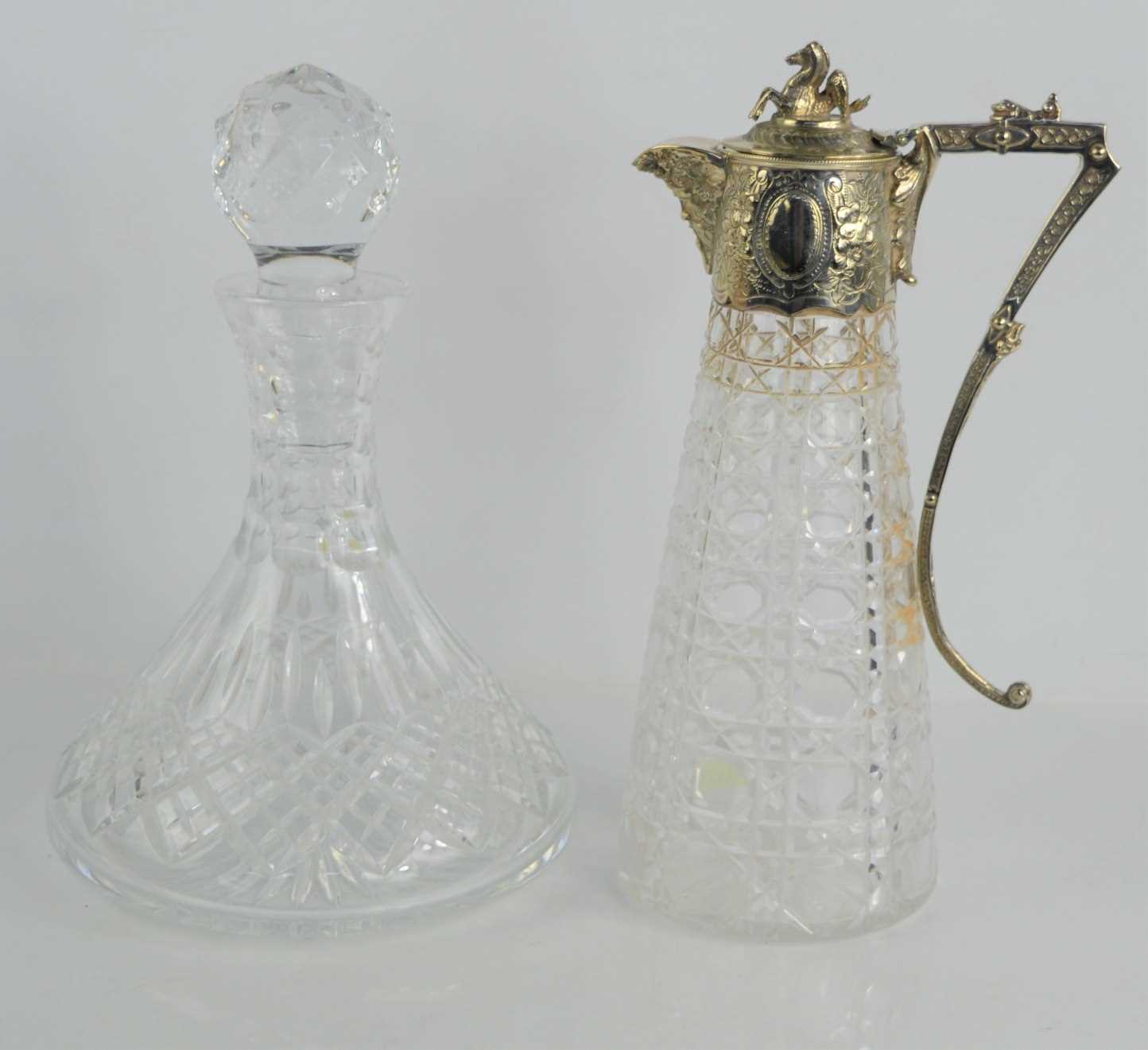 Lot 74 - A cut glass claret jug with silver plated...