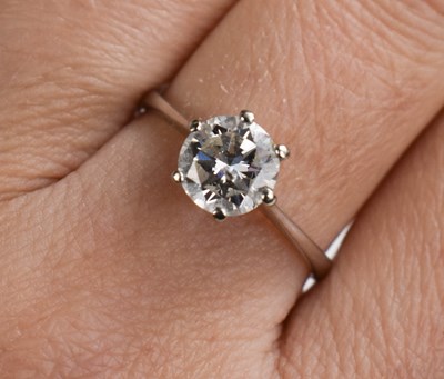Lot 25 - An 18ct white gold and diamond solitaire dress...
