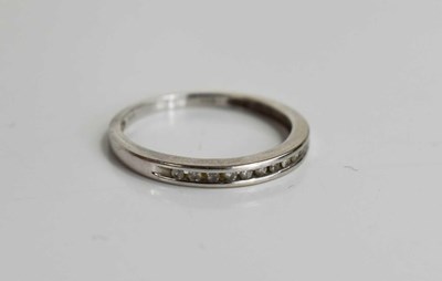 Lot 216 - A 14ct white gold half eternity ring, set with...