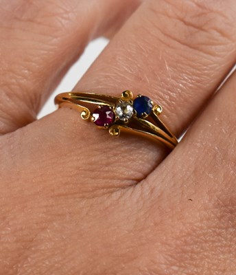 Lot 128 - An 18ct gold, diamond, ruby and sapphire ring,...