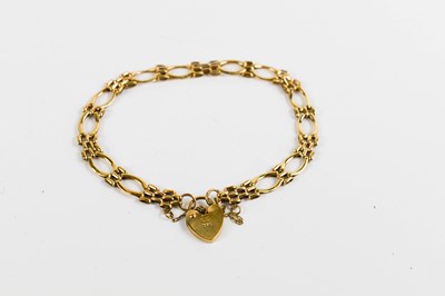 Lot 114 - A 9ct gold oval and gate link charm bracelet,...