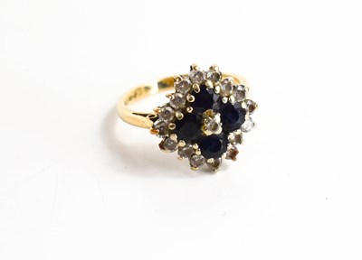 Lot 77 - A 9ct gold sapphire and paste dress ring of...