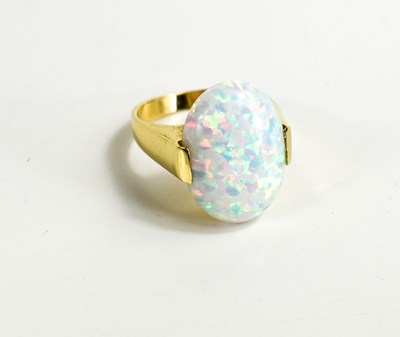 Lot 129 - A 14ct gold and opal ring, the oval cabochon...