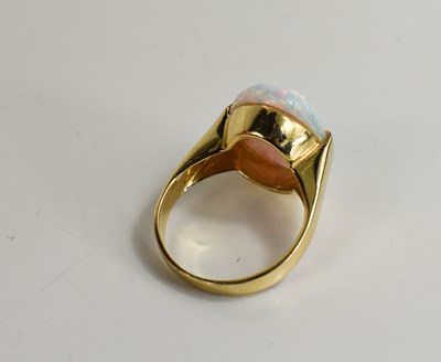 Lot 129 - A 14ct gold and opal ring, the oval cabochon...