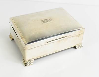 Lot 297 - A silver cigarette box with engine turned...