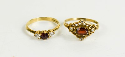 Lot 115 - A 9ct gold three stone dress ring, size L,...