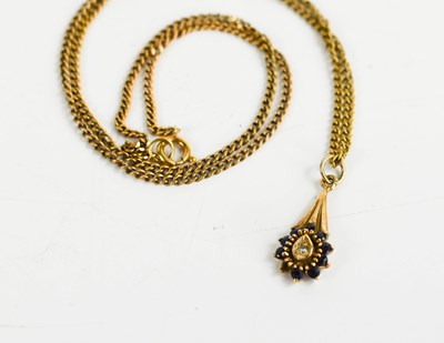 Lot 84 - A 9ct gold, sapphire and diamond pendant and...