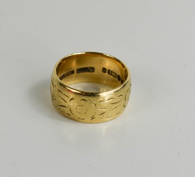 Lot 130 - A 9ct gold wedding band, foliate and flower...