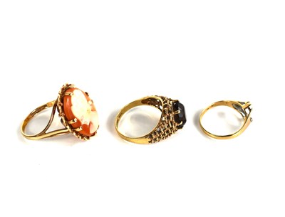 Lot 131 - Three 9ct gold rings, a cameo ring size N,...