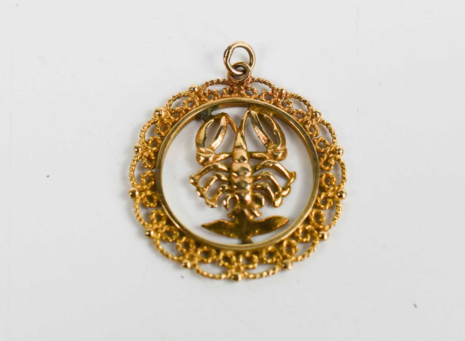 Lot 61 - A 9ct gold pendant set with a lobster with...