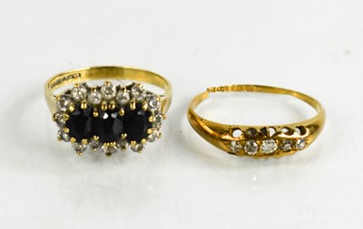 Lot 148 - An 18ct gold and diamond five stone ring, the...