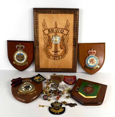 Lot 397 - A group of military badges, buttons and...