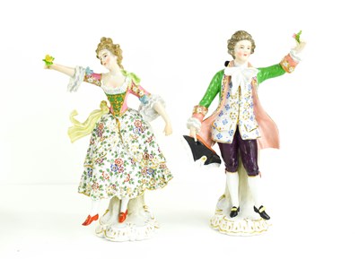 Lot 215 - A pair of Meissen porcelain figurines; lady...