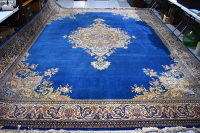 Lot 478 - A large wool carpet, the cobalt blue ground...