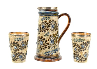 Lot 13 - A pair of Doulton Lambeth stoneware cups and...
