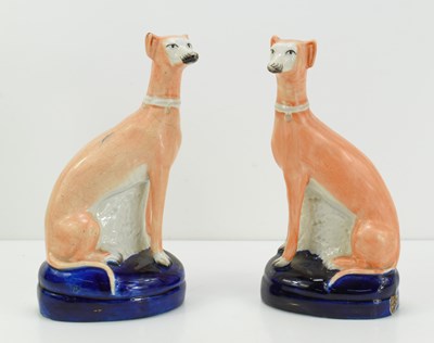 Lot 186 - A pair of 19th century Staffordshire pottery...