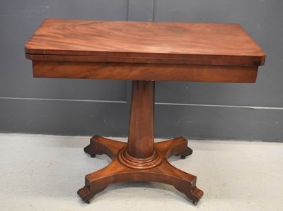 Lot 466 - A mahogany fold over card table, with green...