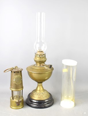 Lot 315 - A miner's lamp, together with a brass based...