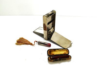 Lot 322 - An Art Deco metal cigarette case and compact...