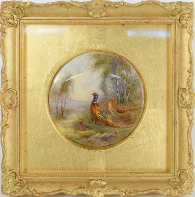 Lot 144 - A Royal Worcester circular plaque painted with...