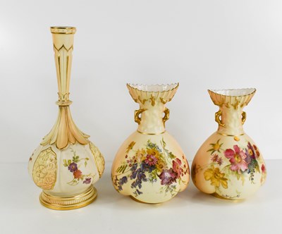 Lot 135 - A pair of Royal Worcester blush ivory ground...