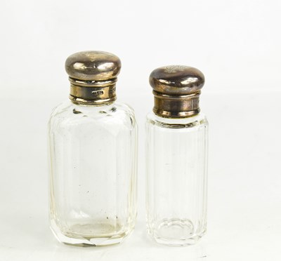 Lot 283 - Two Asprey's silver topped cut glass dressing...