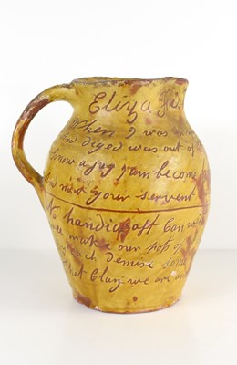 Lot 18 - A 19th century glazed earthenware jug, the...