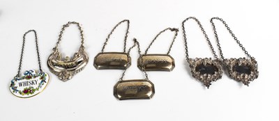 Lot 386 - A selection of bottle tags to include a pair...