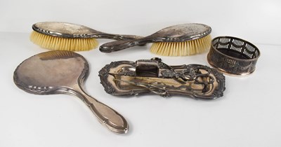 Lot 372 - A pair of silver clad hair brushes, with...