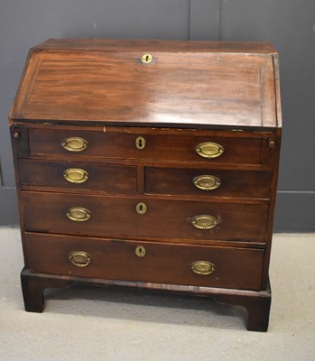 Lot 459 - A 19th century mahogany bureau of small...