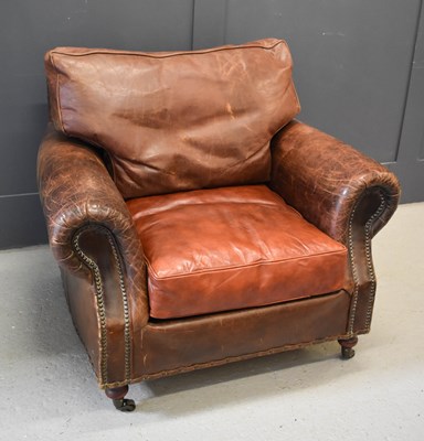 Lot 472 - A vintage leather armchair with studwork,...