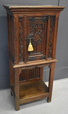 Lot 463 - A 16th century style Gothic oak cupboard, the...