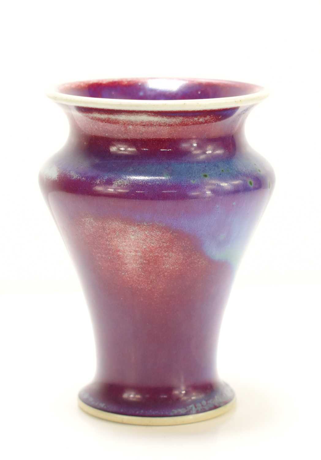 Lot 35 - A Ruskin flambe glazed vase in red, blue and...