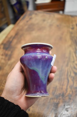 Lot 35 - A Ruskin flambe glazed vase in red, blue and...