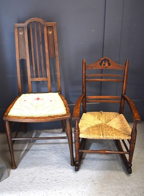 Lot 487 - An Arts and Crafts childs rocking chair by...