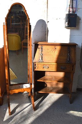 Lot 488 - An Art Nouveau period oak desk, the sloped...