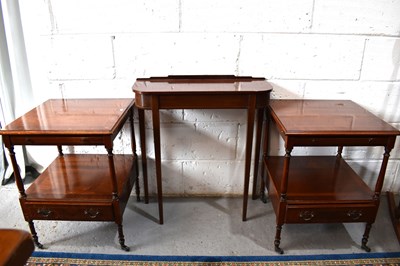 Lot 501 - A pair of mahogany bedside tables with leather...