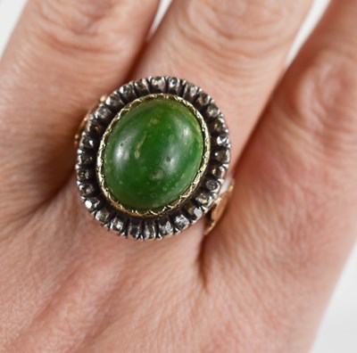 Lot 8 - A 19th century dress ring, set with oval green...