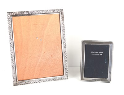 Lot 260 - A small silver photograph frame together with...