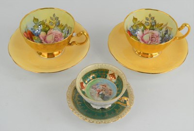 Lot 76 - A pair of Aynsley handpainted cups and saucers...