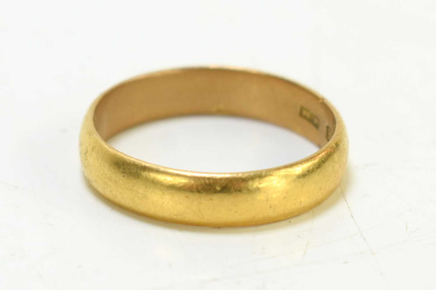 Lot 112 - A 22ct gold wedding band, 5.7g, size R.