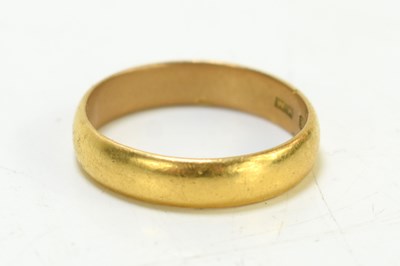 Lot 112 - A 22ct gold wedding band, 5.7g, size R.