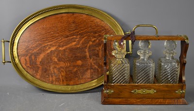 Lot 250 - A Victorian oak cased tantalus, with three cut...